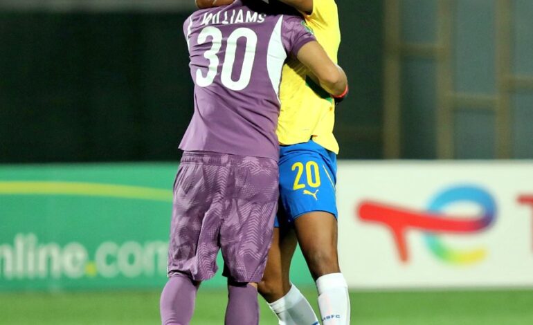 Grant Kekana with Ronwen Williams against Ahly