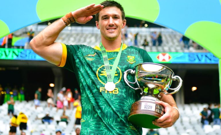 Blitzbok captain Impi Visser holding the Seven trophy