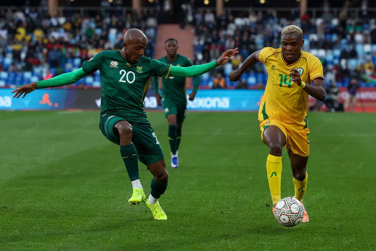 Khuliso Mudau battling with Msendami in the AFCON match