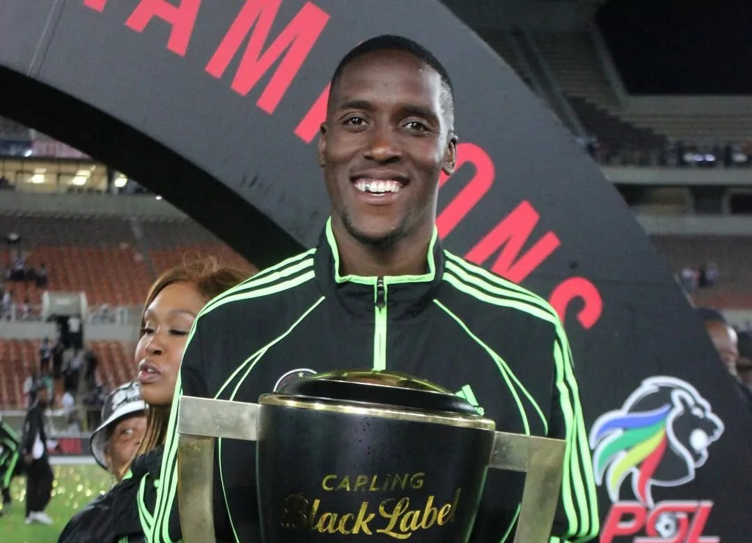 Sifiso Luthuli holding Carling Knockout Cup trophy