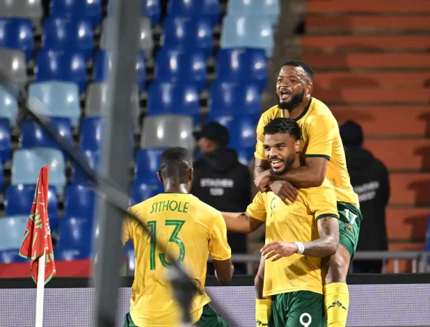 Sphephelo Sithole, Sipho Mbule and Lyle Foster against Angola