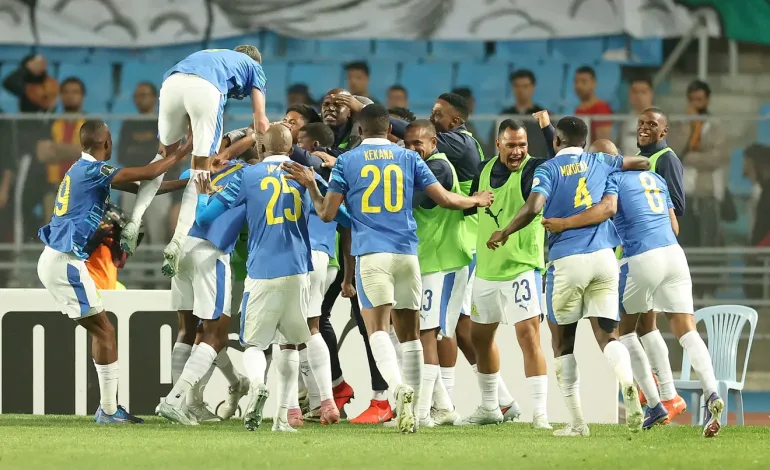 "It's Only Half-Time" – Cardoso Stays Grounded After Sundowns’ Historic Night In Tunisia 2 Grant Kekana and rest of Sundowns players celebrate against Esperance