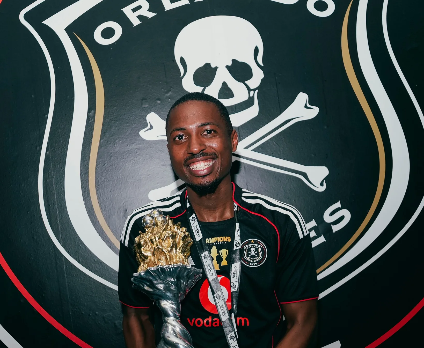 Pirates Set To Part Ways With Treble-Winning Defender 5 Bandile Shandu holding a league title