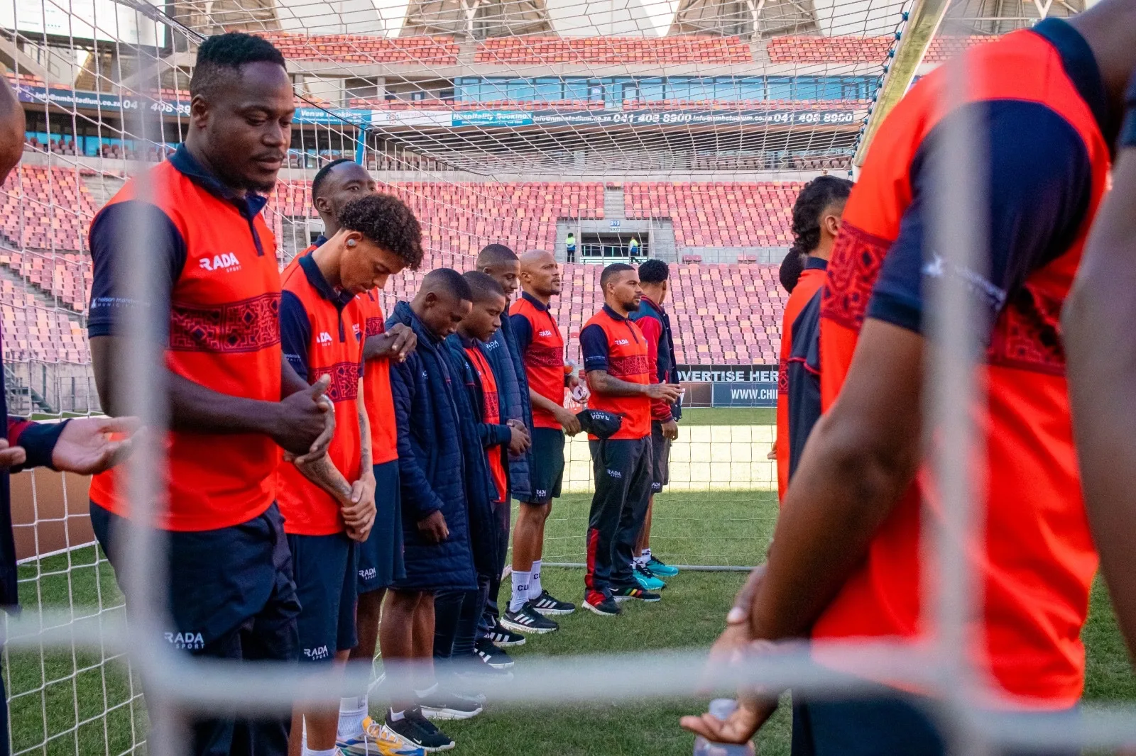 Chippa United players assessing the pitch