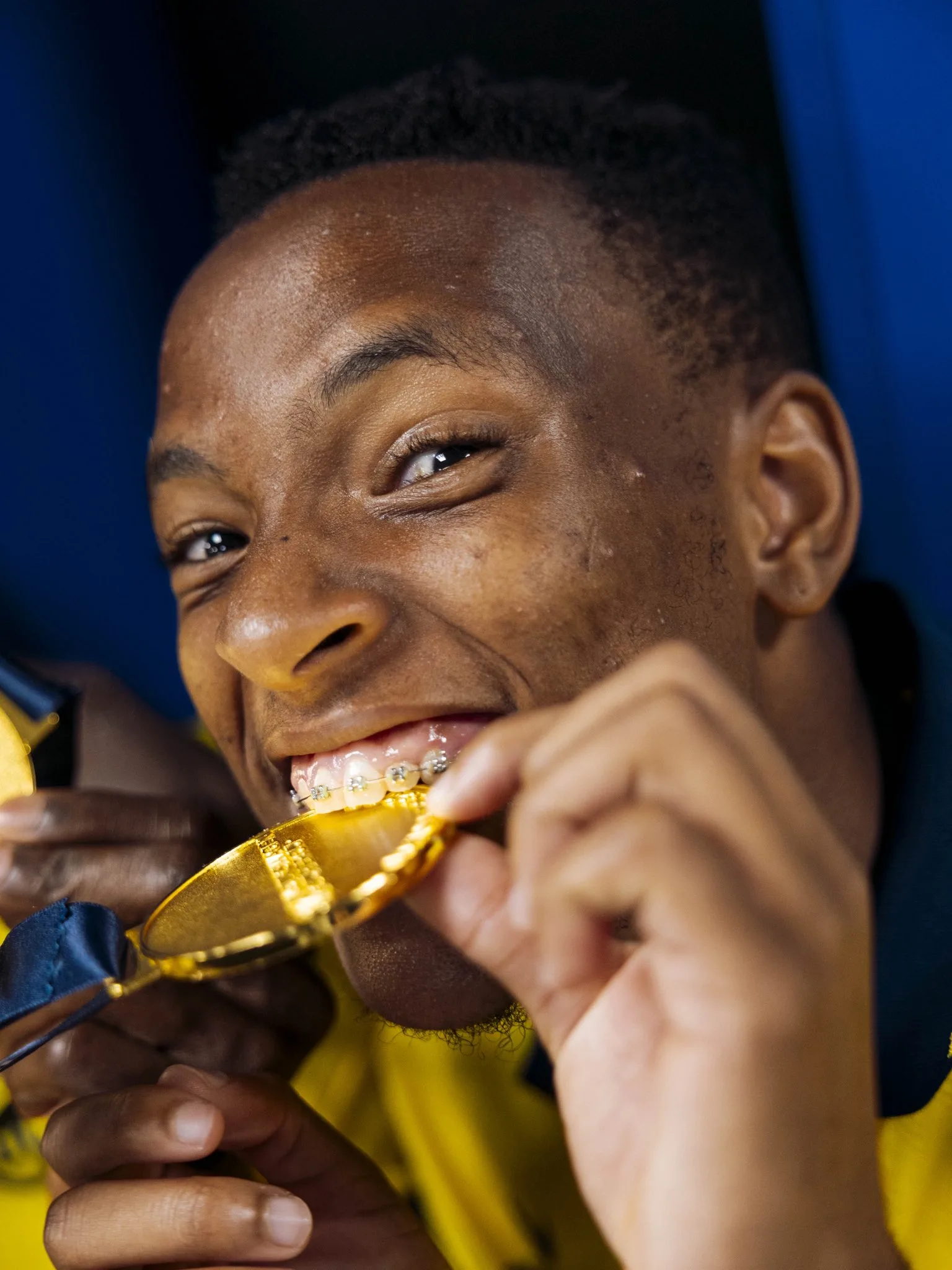 Relebohile Mofokeng biting his first trophy in Europe jpeg